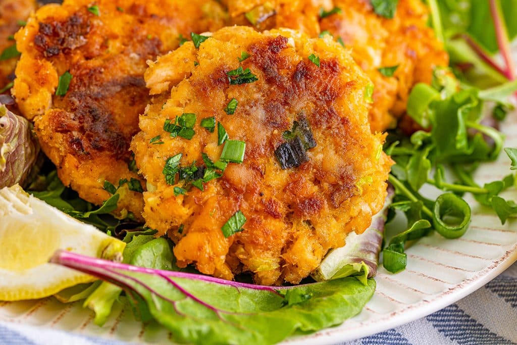 salmon cakes on a white serving plate