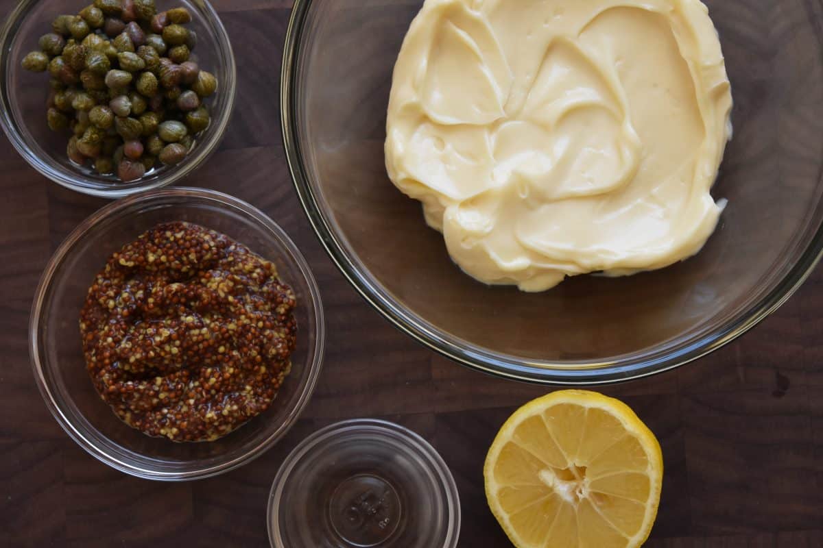 Ingredients for zesty caper sauce: mayo, capers, whole grain mustard, vinegar, and lemon.