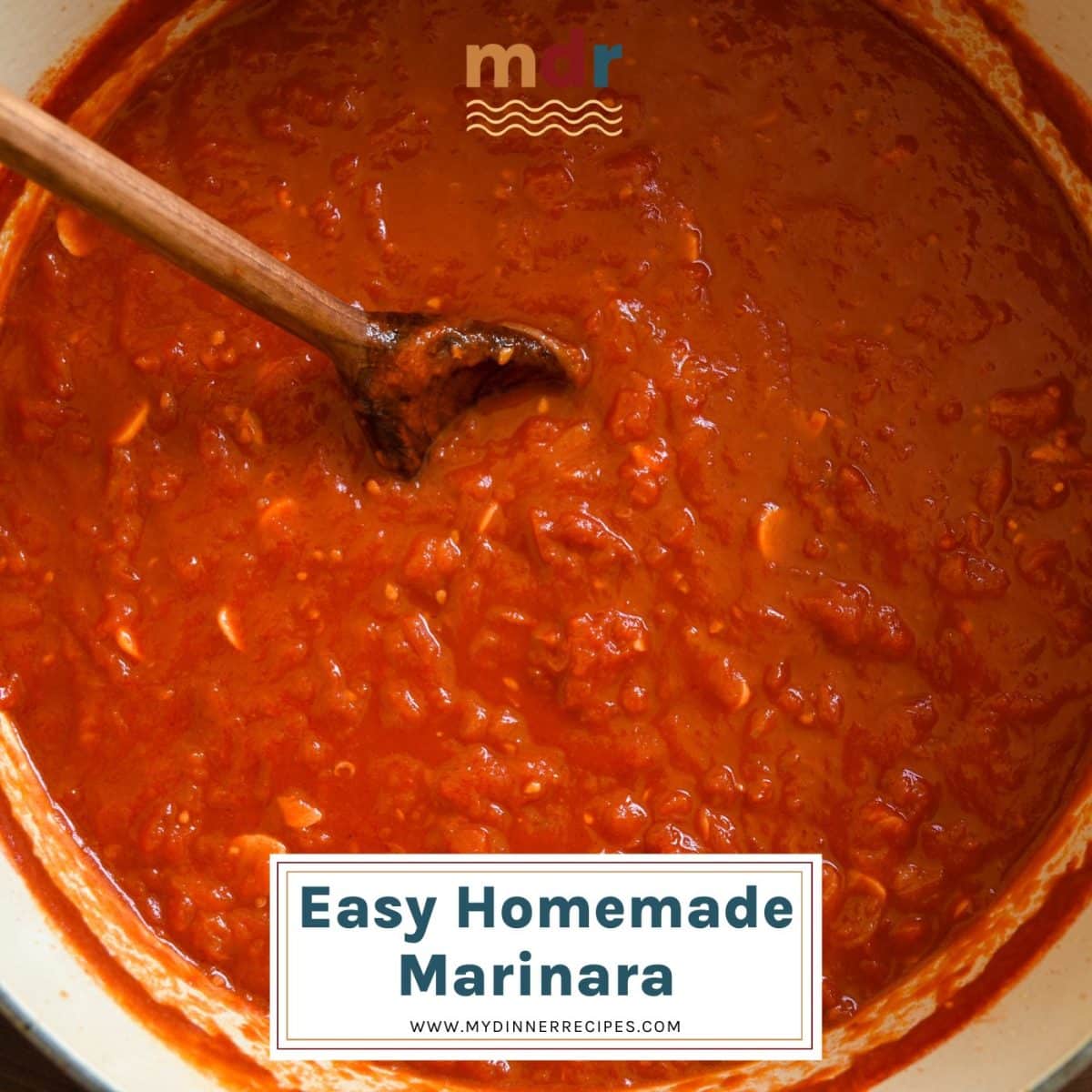 finished easy homemade marinara in a dutch oven with  a wooden spoon
